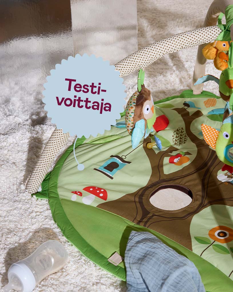 Värikäs babygym, jossa on teksti 'Testi-voittaja'.